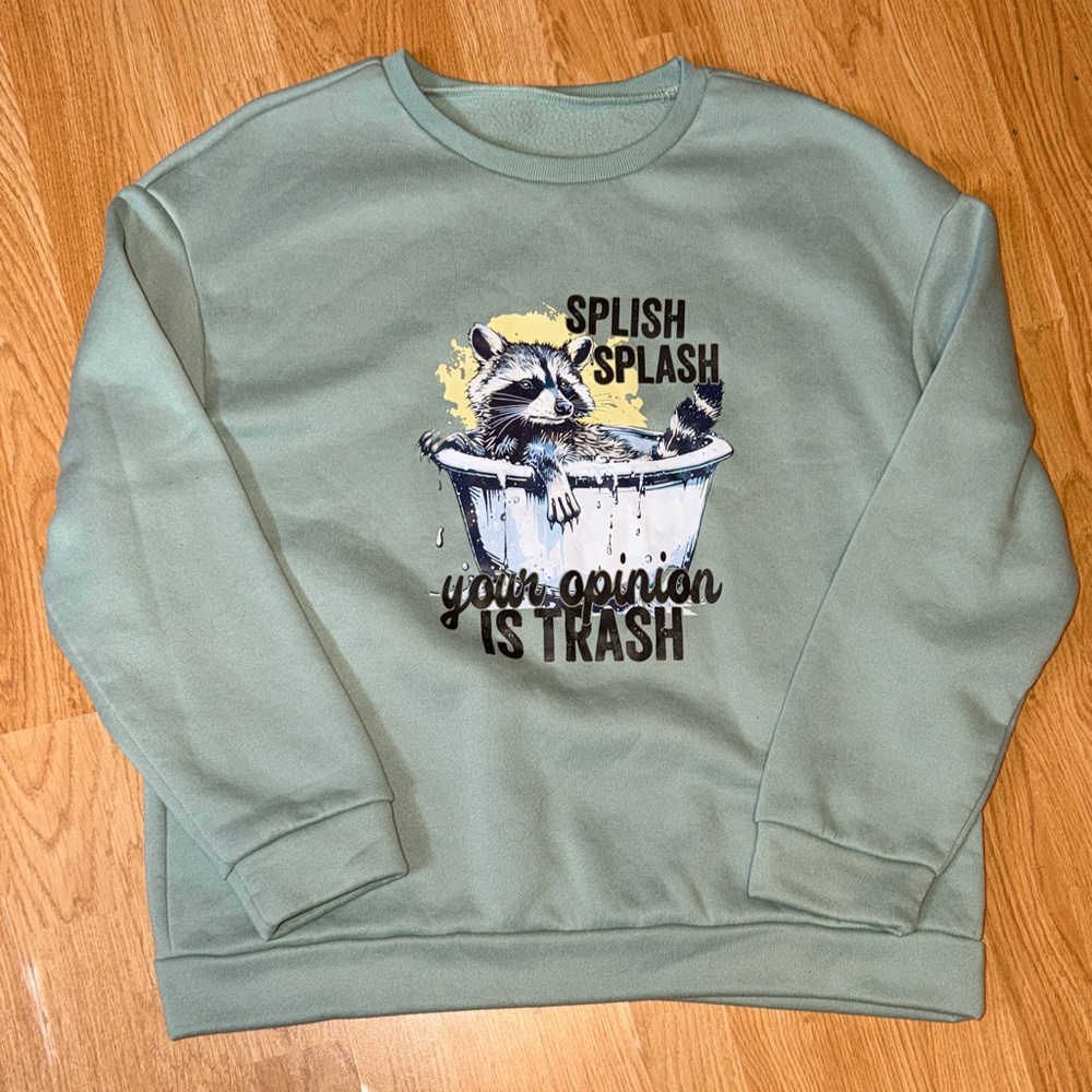 Green Sweatshirt with Raccoon Graphic